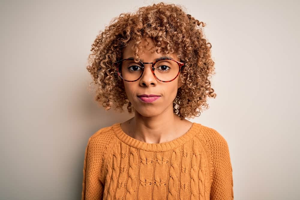 African female wearing a cute brown hair color after deciding to lighten hair prior to using Iroiro color liberator.