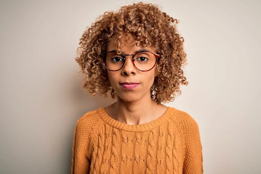How Long Does Iroiro Hair Dye Last? How to Make It Last Longer 5 African female wearing a cute brown hair color after deciding to lighten hair prior to using Iroiro color liberator.