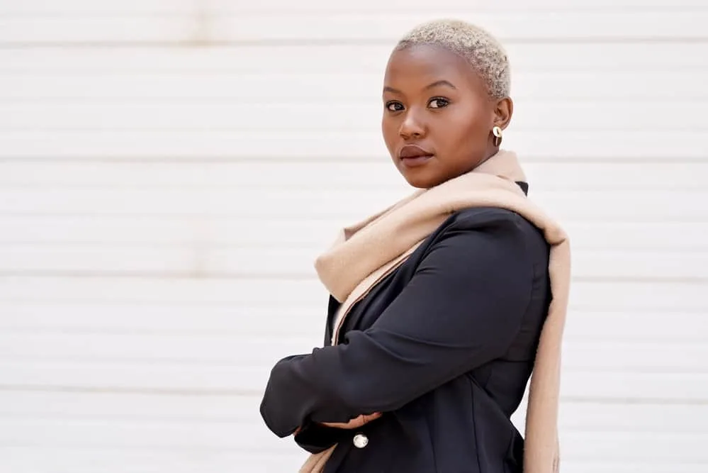 TWA Hairstyles: Short and Medium TWA Styles and Haircuts 4 African American female with kinky curls on touchable short hair creating a nearly bald look.
