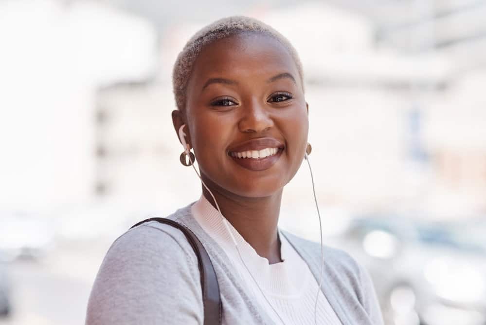 Cute African American female with a light-brown skin tone and a TWA hair length that requires minimal styling.