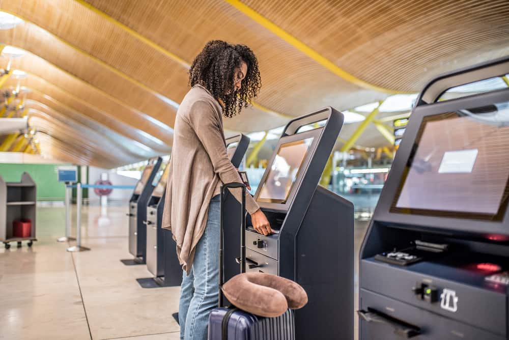 A lady with non-aerosol hairspray in her checked bag is wondering if dry shampoo can be included in a carry-on.