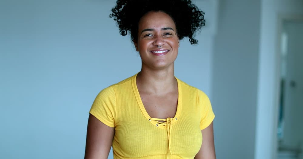 Young black girl that keeps her hair healthy at night by wearing bonnets and protective natural hairstyles.