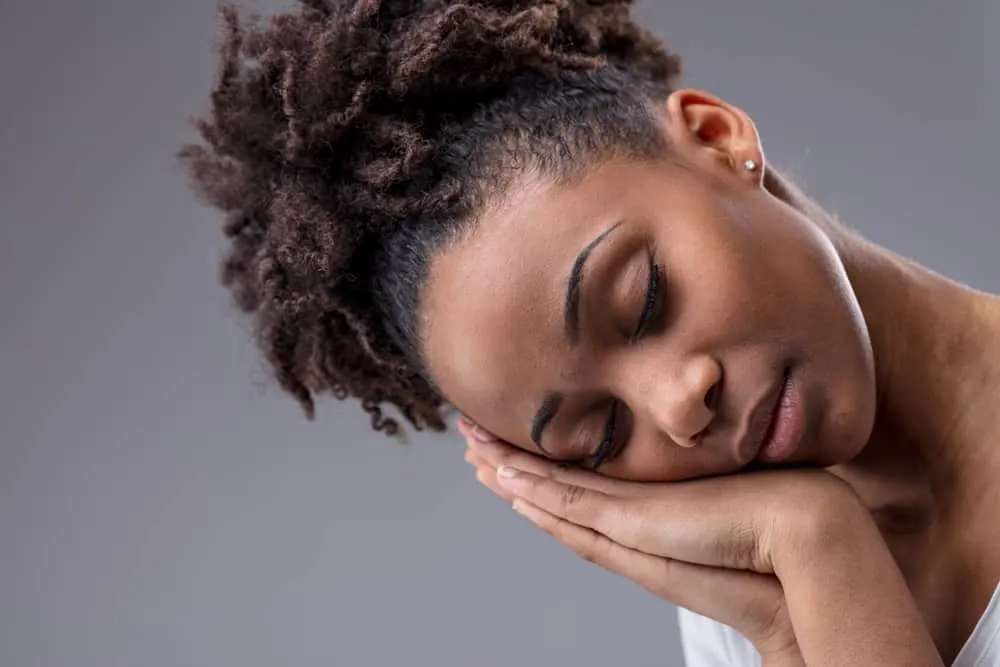 Can You Use Toner Without Developer? Best Toners on the Market 5 Tired black female with light hair tips and dark brown hair underneath getting a new hairdo from her hair stylist.