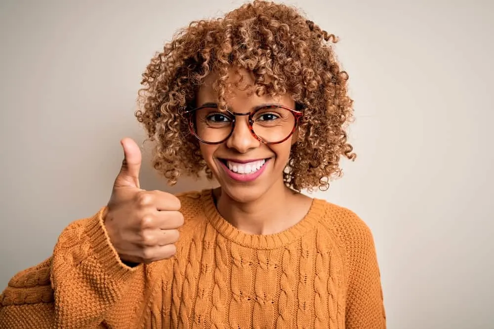 How Long Does Iroiro Hair Dye Last? How to Make It Last Longer 4 Young black lady with dry hair after using an Iroiro hair color product on her 3C natural curls and kinks.