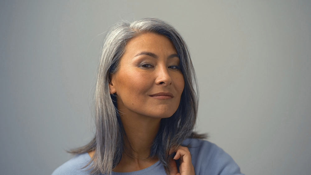 A lovely Asian woman with her silver hair dyed wishes to get rid of permanent hair color to show off her natural locks.