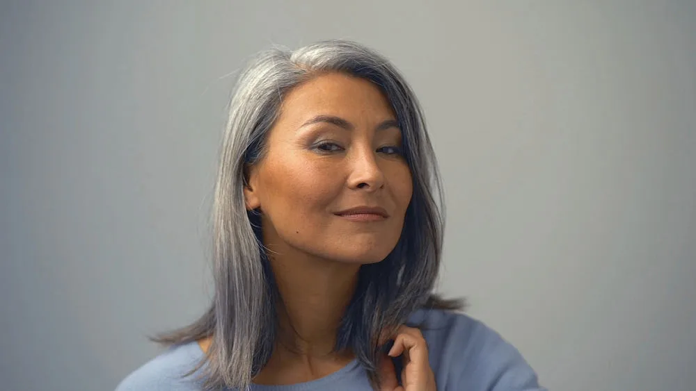 Removing Hair Color to Go Grey at Home: DIY How-to Guide 10 A lovely Asian woman with her silver hair dyed wishes to get rid of permanent hair color to show off her natural locks.