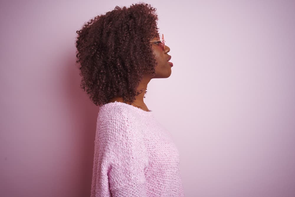 African female wearing a style with braiding hair attached to a cornrow creates a very natural hairline. 