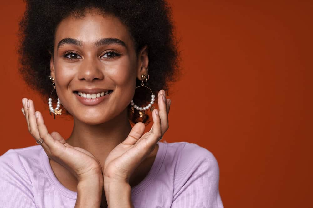 Young black lady with 4B curly hair called "natural hair" by most ladies within Curly Girl Community.