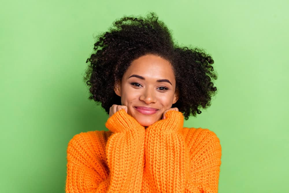 Pretty young African American female wondering what's making her dark brown natural hair lighter.