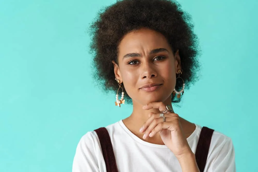 Why Won’t My Hair Take Color? How to Fix the Problem 1 Young black woman with colored hair cuticles after using a mixture of blue and brown permanent dyes.