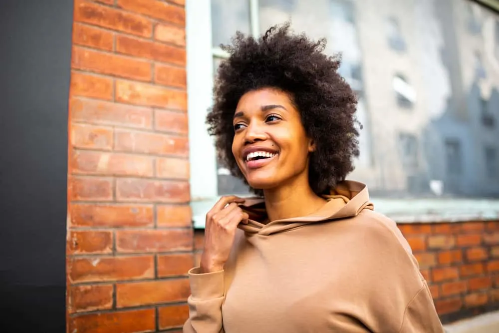 Why Is My Hair Matting Underneath? Prevent Hair From Matting 5 Light skinned black woman with gorgeous hair wearing a wash-n-go style created with a wide-toothed comb.