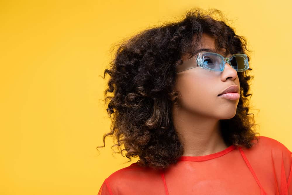 The light-skinned, young black woman with medium-length hair.