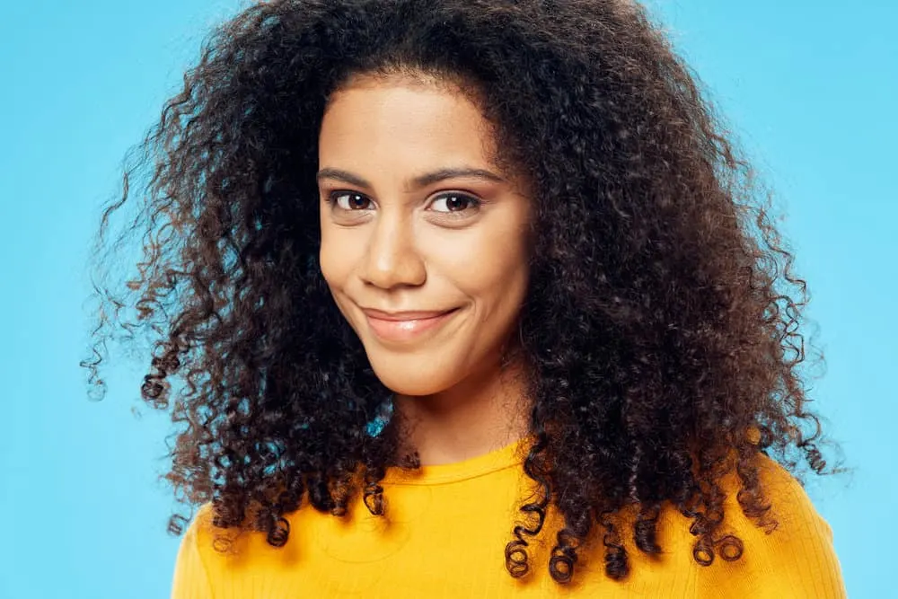 Does Prose Help With Hair Loss, Thinning, or Breakage? 1 Cute young black girl with curly hair follicles that suffered from female pattern hair loss and hair thinning.