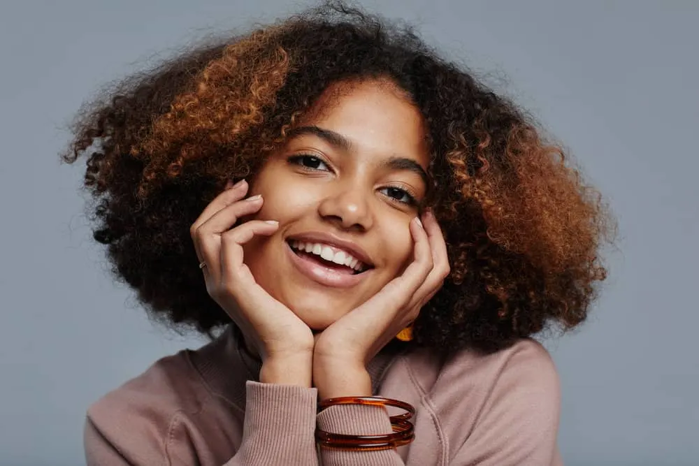 Does Shampoo Freeze? What Temperature? What Happens? 1 African American female with black and brown curly hair after using Prose shampoo and conditioner.