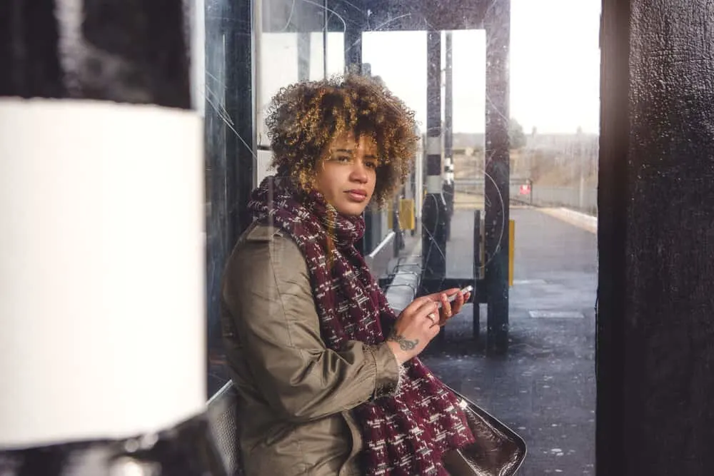 Poofy Hair: What Causes It, How To Fix It, and Prevent It 6 Cute African American female wearing her hair wavy in a wash n' go style created with a wide-toothed comb.