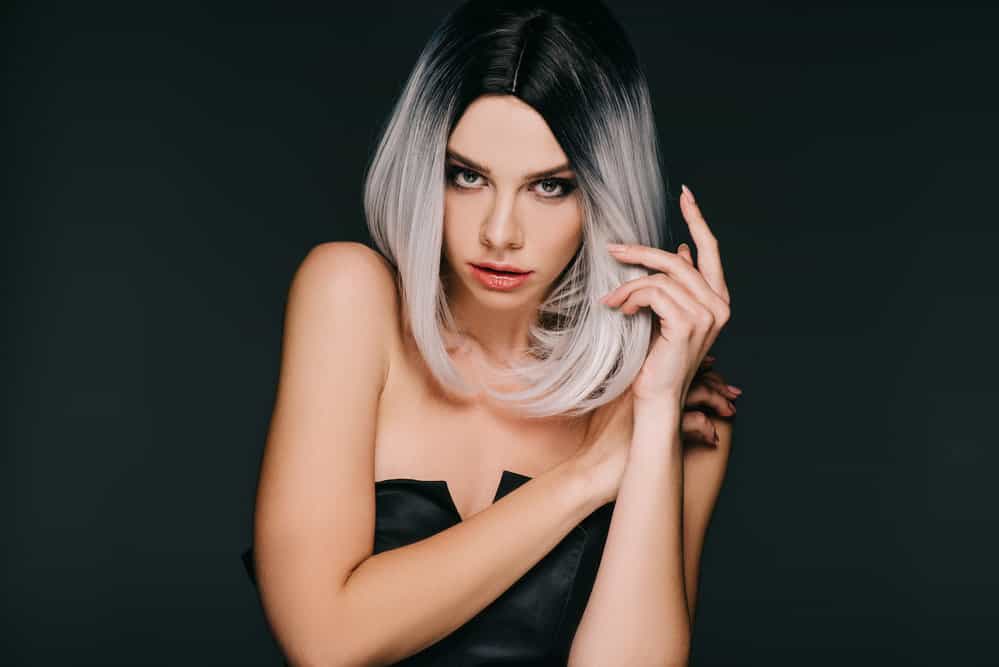 Young girl showing how to achieve Narcissa Malfoy hair color covering her natural brunette shade (i.e., own locks).