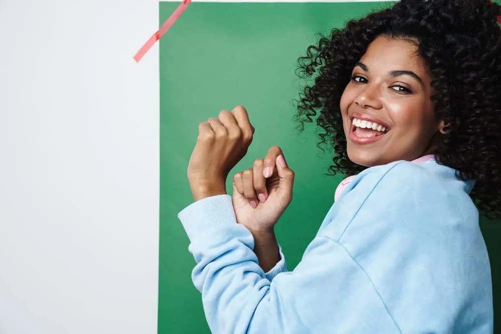 Does Olaplex Help With Dandruff? Will Olaplex Help Dry Scalp? 11 Cute young black girl that used Olaplex within her hair routine making her scalp itchy and creating flare-ups.