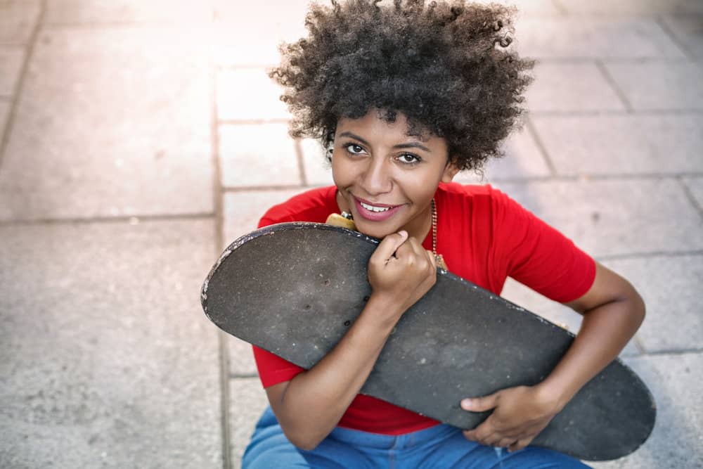 A young skateboarder after her hair was colored by the salon owner at a Paul Mitchell salon.