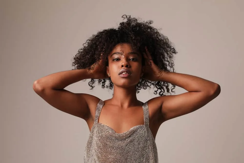 How Much Does Prose Hair Care Cost? Are the Products Worth It? 1 A beautiful young black girl with shiny hair after using prose shampoo within her hair routine on a 4A hair type.
