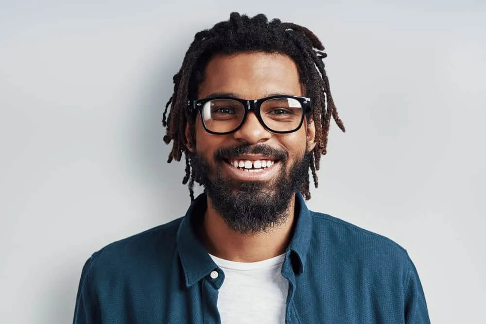 How To Get Dandruff Flakes Out Of Dreadlocks: DIY Step-by-Step 1 A young man with an itchy scalp due to seborrheic dermatitis aka dandruff after using an apple cider vinegar rinse.