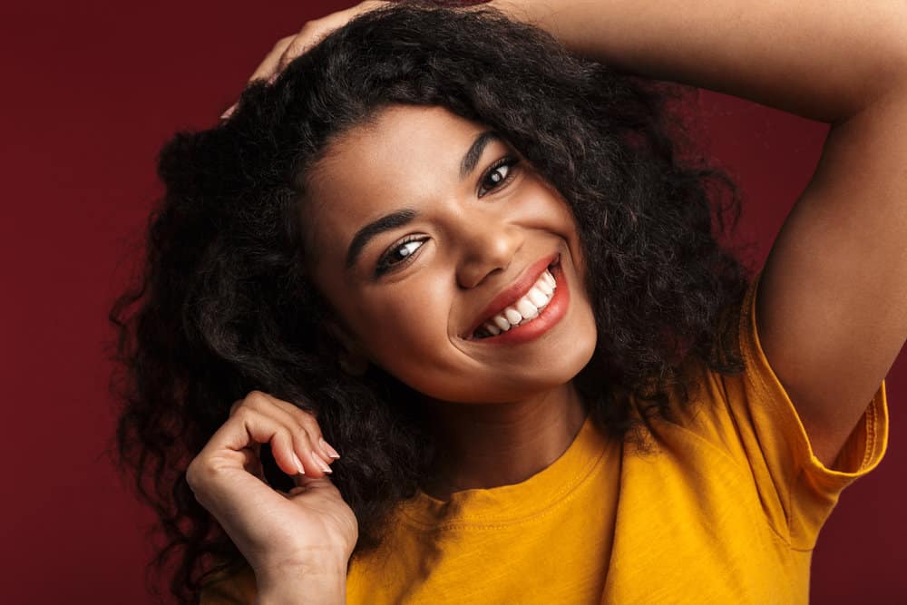 A lady with perfectly straight hair that turns wavy after getting excess moisture and humidity.