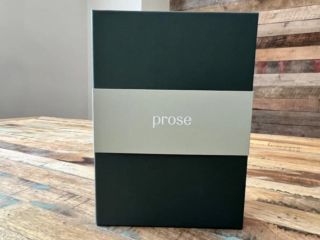 Unopened Prose box containing a customized shampoo and fragrance-free hair oil that can improve hair health.