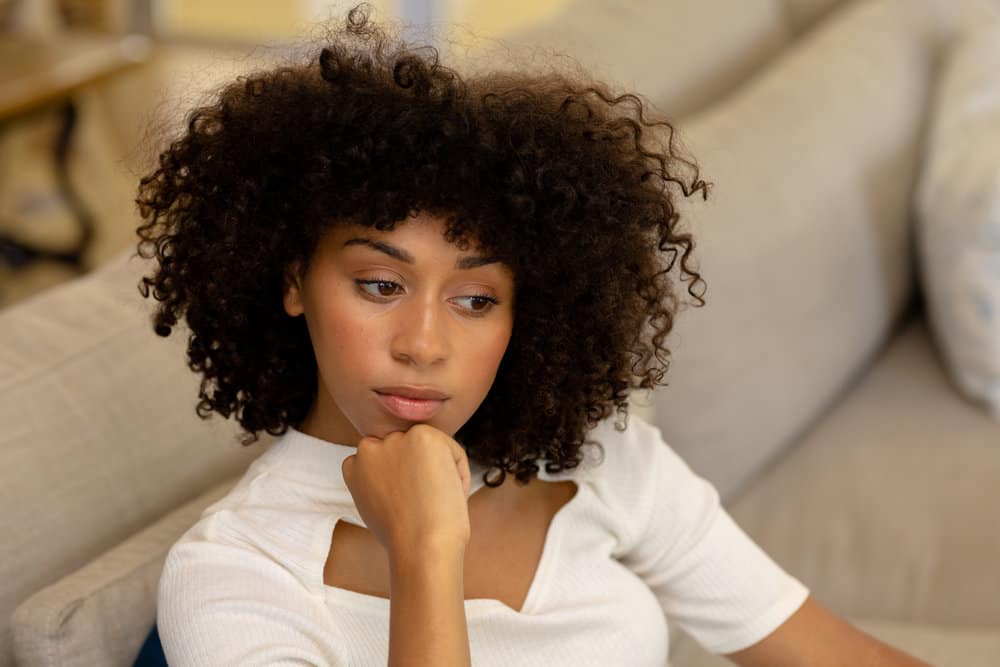 Black woman with type 4a curls wondering if camphor oil is good for her hair.