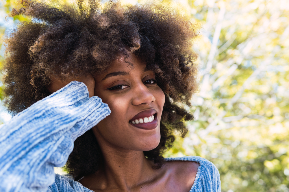 African American female with high porosity hair strands, a 4C hair texture on curly, and curly hair cuticles.