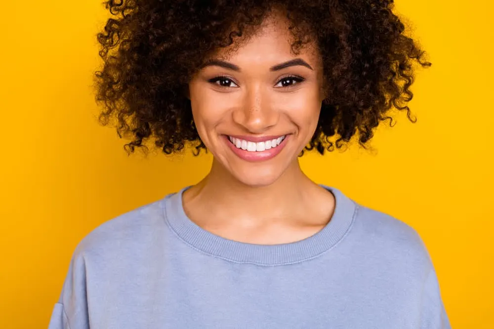 Cardi B Hair Mask: Recipe, Tutorial, Benefits, and More 2 A pretty young American female wearing a good hair mask with nourishing ingredients like two avocados.