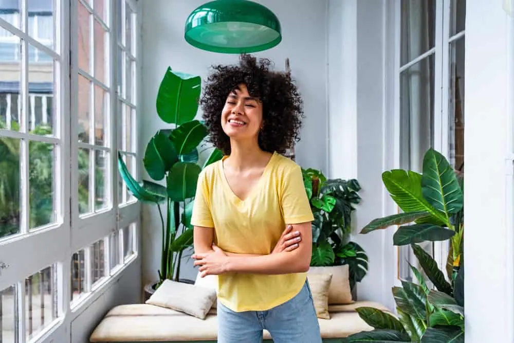 Does Rice Water Expire? Can You Use Old Rice Water? 5 Young female with curly hair and cute laugh lines enjoying a nice sunny day at home.