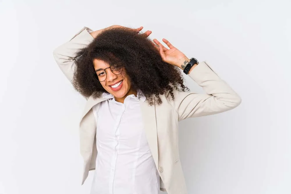 Is Curly Hair Professional or Unprofessional? Best Workplace Styles 3 Black lady with longer hair than most black women deciding not to wear her hair straight in a corporate setting.