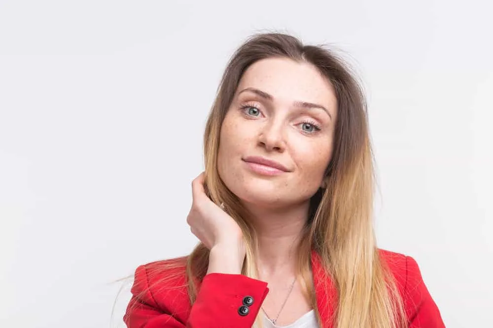 Why Do Jewish Women Wear Wigs? Do Wives Have to Wear Wigs? 4 A freckled Jewish woman with beautiful eyes showing off her real hair.