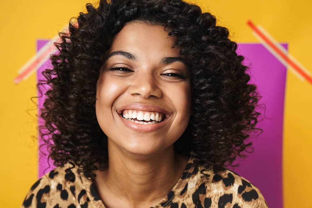 Cute light-skinned female with her scalp flaking after using hair dye with harsh chemicals making dandruff worse.