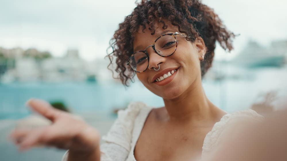 A cute young black lady with long hair has had basically straight hair her entire life until recently.