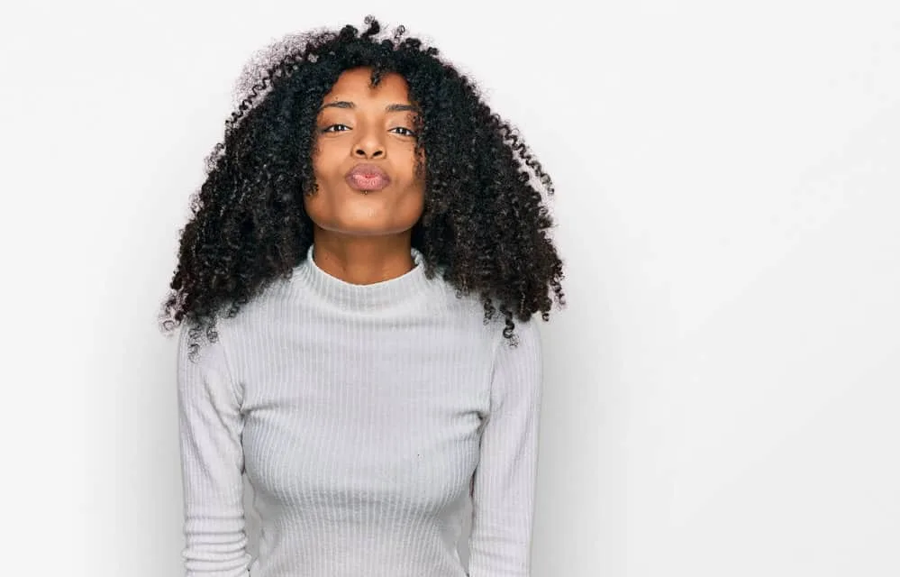 Why Is My Hair Stretchy? Is It Normal? What Does It Mean? 9 A lady with damaged bleached hair wants to increase hair flexibility with a protein treatment for curly hair types.