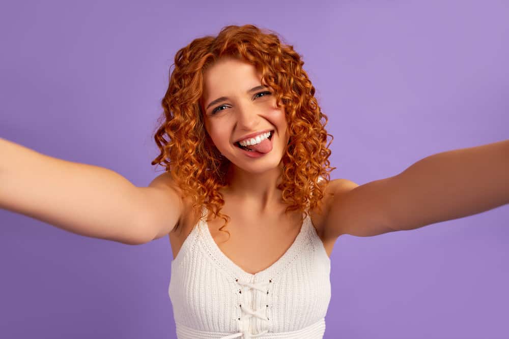 A white female with naturally darker hair dyed her waves, now she's wondering what hair color cancels orange.