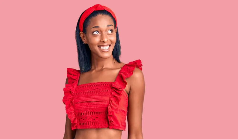 What Happens If You Don't Rinse Out a Brazilian Blowout? 7 A young lady is smiling after the Brazilian Blowout left her hair smoother and stick straight.