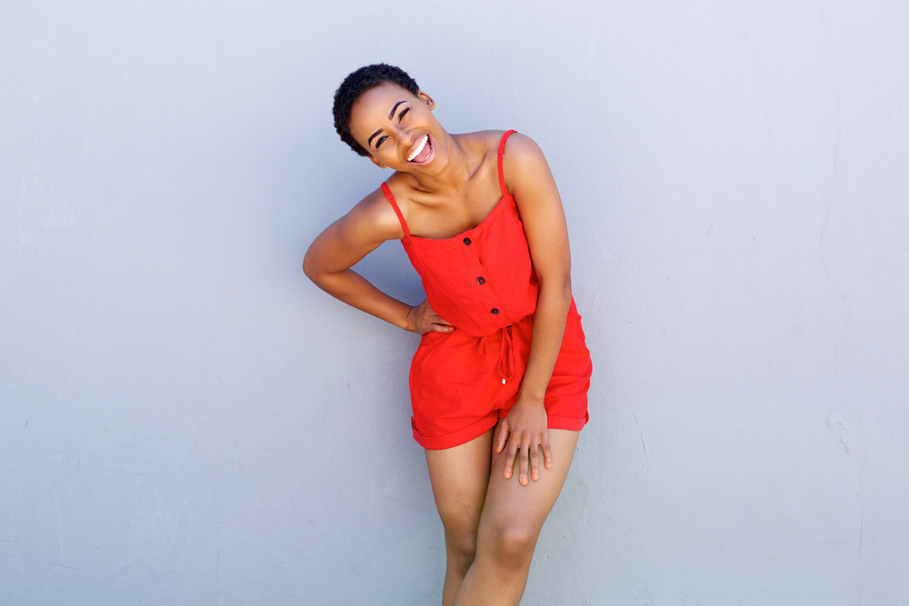 African female with short twisted hair covering her entire head staying in place with a firm-hold hair gel.