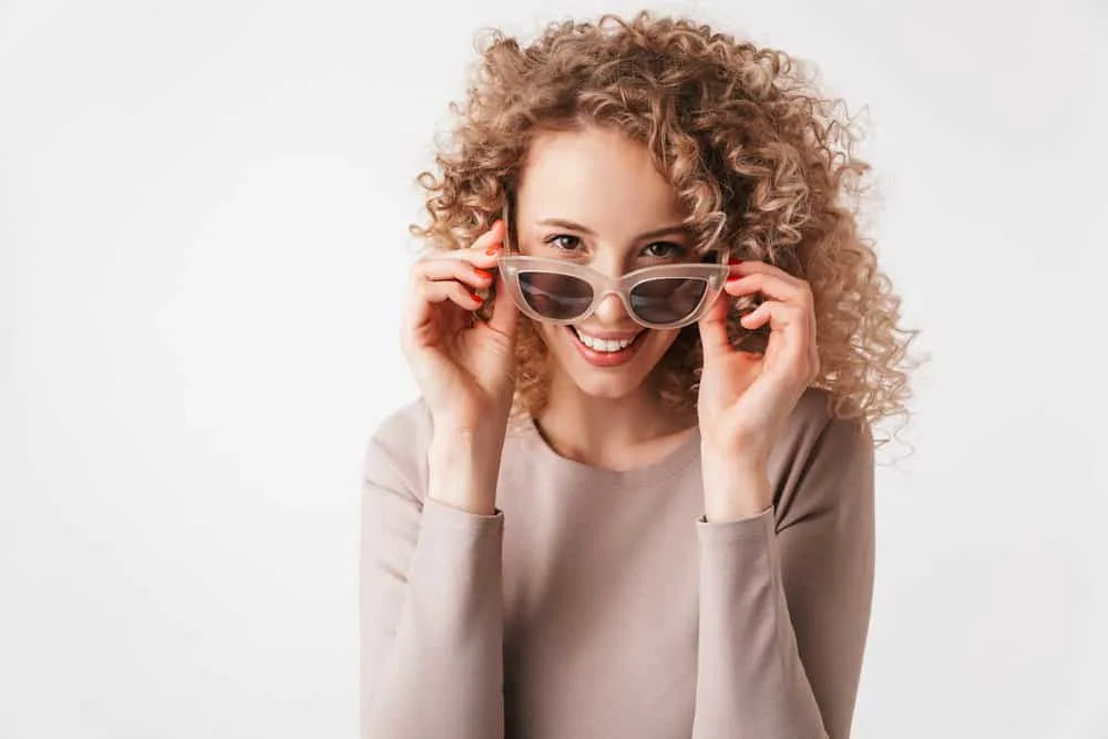 How Much Does Balayage Cost? Average Balayage Prices 3 A lady with blonde highlights and darker roots that were naturally blended into her blonde, brown, and gray hair.