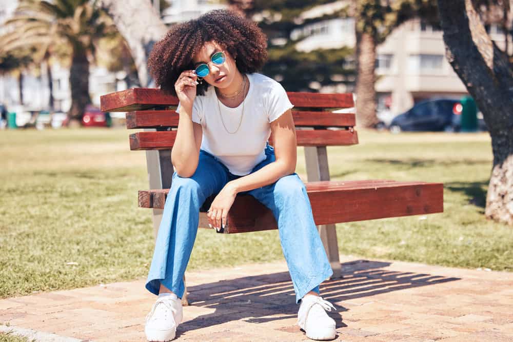 A light-skinned black girl that experienced hair loss two years ago now has beautiful natural curls.