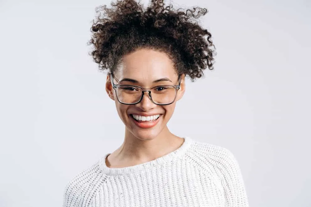 Does Maui Moisture Cause Hair Loss? What About Their Shampoo? 1 A cute black female with thinning hair cleaned with Maui moisture shampoo - a Curly Girl-approved product.