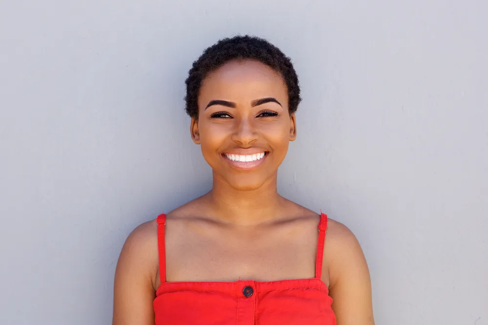 Is My Hair Too Short for Braids? How to Braid Short Hair 11 A young black woman that doesn't have long hair that wants to install short braids (or hair extensions).