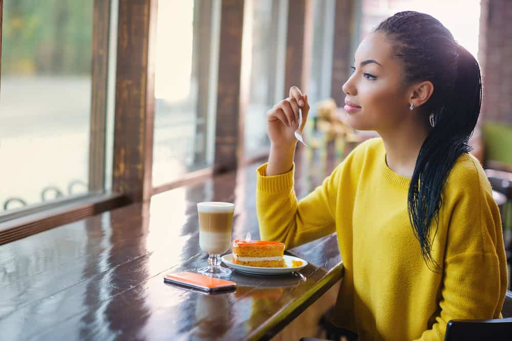 A mixed-race female with textured hair wondering if her hair grows longer while wearing micro locs.