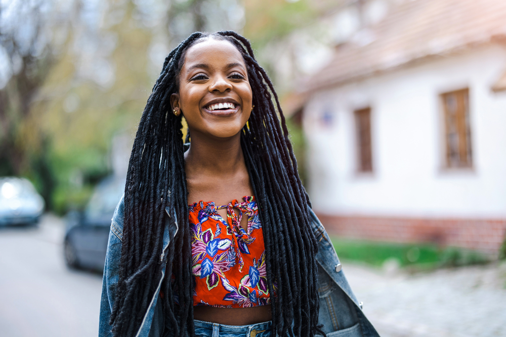 A pretty young lady with 4A hair type wearing a time-consuming locked hairstyle created a regular comb.