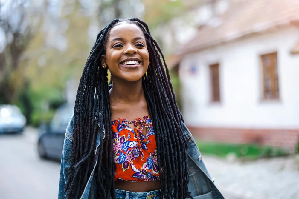 Removing Dreadlocks: How to Remove Dreadlocks at Home 4 A pretty young lady with 4A hair type wearing a time-consuming locked hairstyle created a regular comb.