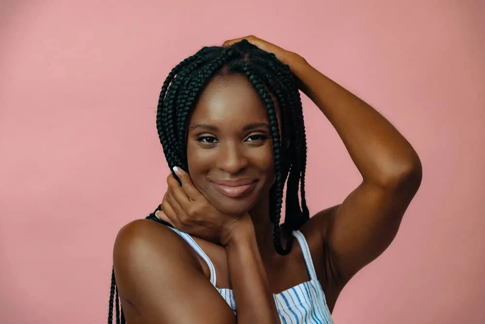 Should I Straighten My Hair Before Getting Braids or Stretch It? 3 A black lady with micro braids installed at a cheaper hair beautician is starting to experience loose hair.