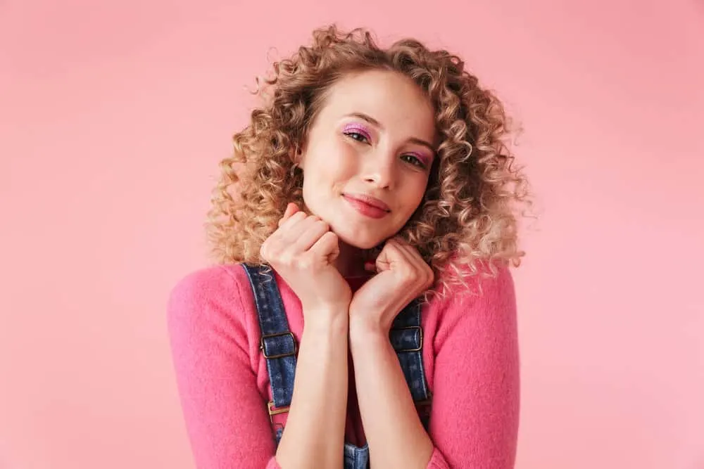 How Long Does Balayage Take to Do or Process In a Salon 9 A white girl with a standard balayage hairstyle with a soft transition from dark to light hair, creating a natural look.