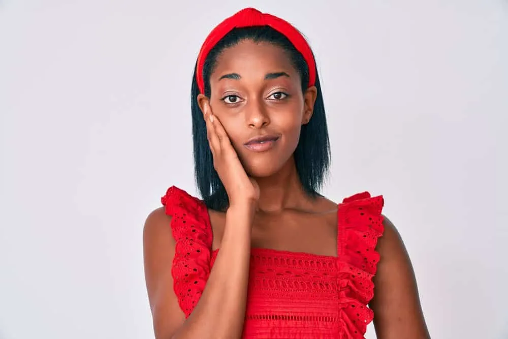 What Happens If You Don't Rinse Out a Brazilian Blowout? 4 A lady with stick straight strands after getting two different hair treatments to recover moisture lost.