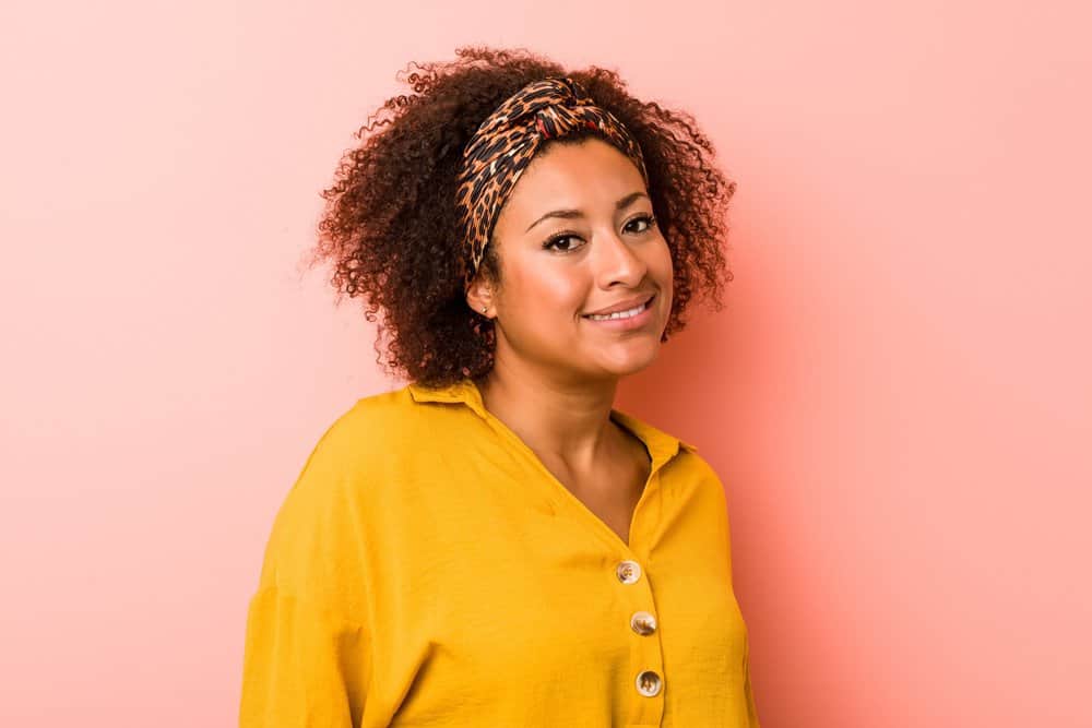 Young African American female with a dark brown natural hair color that's been dyed with Splat hair color.