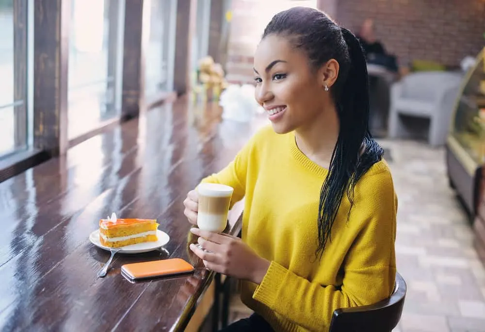 Microlocs: Styles, Installation, Cost, Products, and More 8 A beautiful young African American woman with micro locs started with two-strand twist needs a re-tightening.